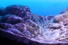 Likoma_Islandu2019s_rocky_habitat_Southeast_of_Lake_Malawi_Mozambique_waters_1-1024x249